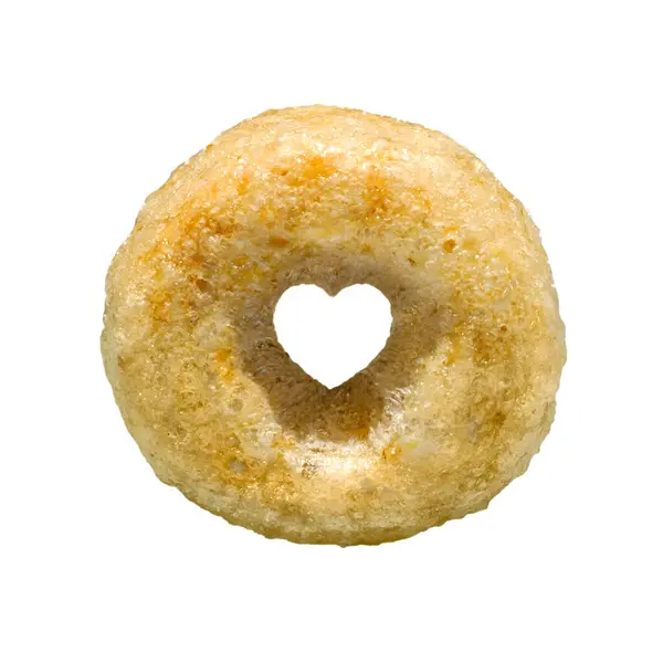 Cheerios mısır gevreği sağlık konsepti için kalp merkezi. Bireysel döngü halkası beyaz arkaplanda izole edildi.