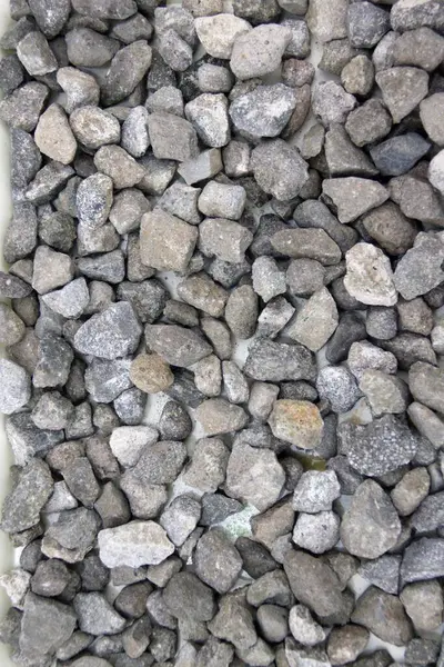 Closeup of photo pile of stone pebbles as a background