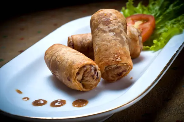 Picture of spring rolls filled with vegetables, typical Indonesian snack menu, taking pictures with decoration and artistic value, food photography