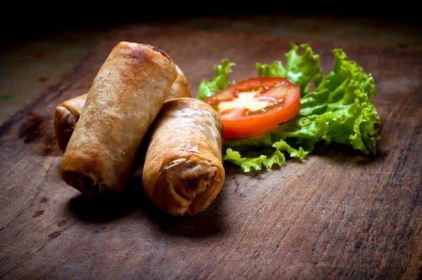 Picture of spring rolls filled with vegetables, typical Indonesian snack menu, taking pictures with decoration and artistic value, food photography