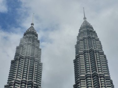 Twin Towers a popular tourist attraction in Kuala Lumpur city of Malaysia clipart