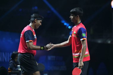 Chennai, Hindistan. 27 Mart 2025. Hintli çift Sharath Achanta ve Snehit Suravajjula, Avustralyalı çift Nicholas Lum ve Finn Luu 'yu yendi.