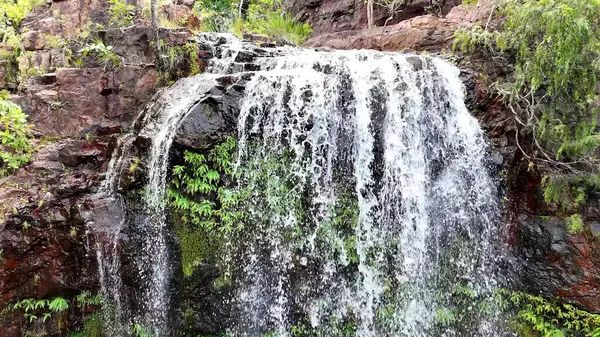 Florence Falls (Aboriginal Karrimurra) is a waterfall on Florence Creek in Litchfield National Park in the Northern Territory Australia. 80 kilometres south of Darwin. Florence Falls is swimming hole