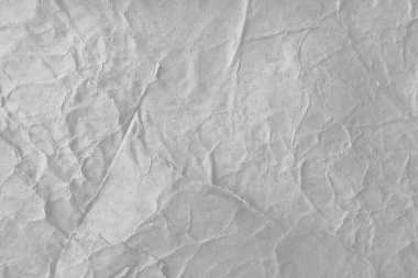 Buruşmuş kağıt veya kumaş dokusu arkaplanının dağınık kaplamasına sahip yaratıcı arkaplan.