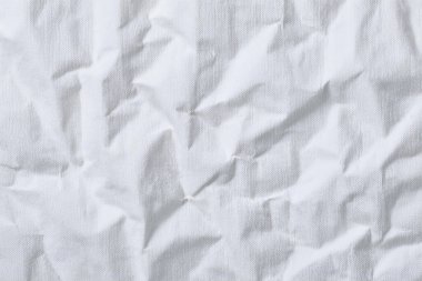 Buruşmuş kağıt veya kumaş dokusu arka plan tasarımından oluşan yaratıcı bir arka plan. Beyaz geri dönüştürülmüş kağıt poster dokusu arkaplanı.