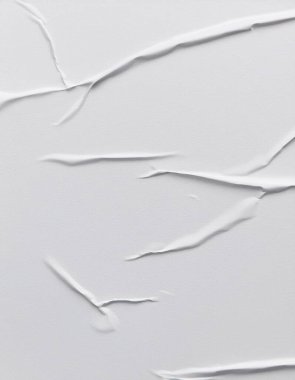 Beyaz katlanmış kağıt veya kumaş dokusu arka plan tasarımının yaratıcı arka planı. Beyaz katlanmış kağıt poster dokusu arkaplanı.