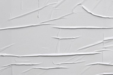 Beyaz katlanmış kağıt veya kumaş dokusu arka plan tasarımının yaratıcı arka planı. Beyaz katlanmış kağıt poster dokusu arkaplanı.