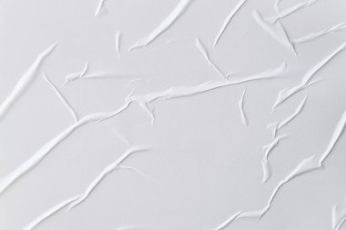 Beyaz katlanmış kağıt veya kumaş dokusu arka plan tasarımının yaratıcı arka planı. Beyaz katlanmış kağıt poster dokusu arkaplanı.