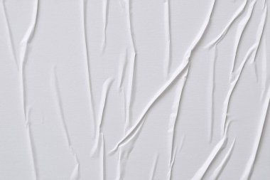 Beyaz katlanmış kağıt veya kumaş dokusu arka plan tasarımının yaratıcı arka planı. Beyaz katlanmış kağıt poster dokusu arkaplanı.