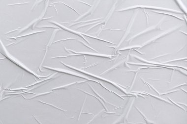 Beyaz katlanmış kağıt veya kumaş dokusu arka plan tasarımının yaratıcı arka planı. Beyaz katlanmış kağıt poster dokusu arkaplanı.