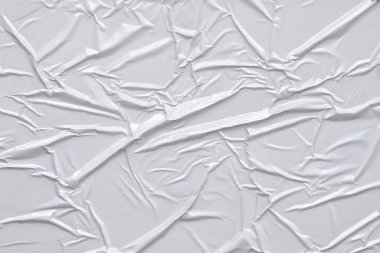 Beyaz katlanmış kağıt veya kumaş dokusu arka plan tasarımının yaratıcı arka planı. Beyaz katlanmış kağıt poster dokusu arkaplanı.