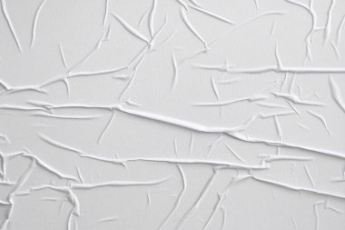 Beyaz katlanmış kağıt veya kumaş dokusu arka plan tasarımının yaratıcı arka planı. Beyaz katlanmış kağıt poster dokusu arkaplanı.