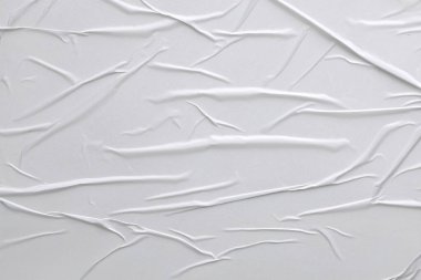Beyaz katlanmış kağıt veya kumaş dokusu arka plan tasarımının yaratıcı arka planı. Beyaz katlanmış kağıt poster dokusu arkaplanı.