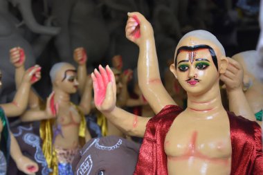 Howrah, India -13th September, 2023: Clay idols of God Vishwakarma are under making ahead of the annual one day Vishwakarma puja, which scheduled on 18th September, 2023. God Vishwakarma is considered as architect of  gods in Hindu mythology clipart