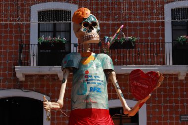 October 20, 2023 in Atlixco, Mexico: A monumental Catrina that was installed as part of the Day of the Dead celebration, is seen in the main square in the municipality of Atlixco clipart