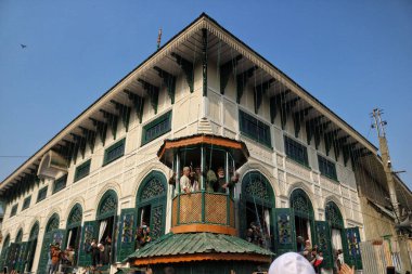 October 27,2023, Srinagar Kashmir, India : Muslim devotees pray and react as a priest displays a relic of Sheikh Syed Abdul Qadir Jeelani at his shrine in Srinagar clipart