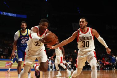 November 12, 2023 in Mexico City, Mexico: E.J. Libdell (L) and Devin Cannady of the Birmingham Squadron, in action against Capitanes of Mexico City during the Mexico City Capitanes vs Birmingham Squadron match of the NBA G League clipart