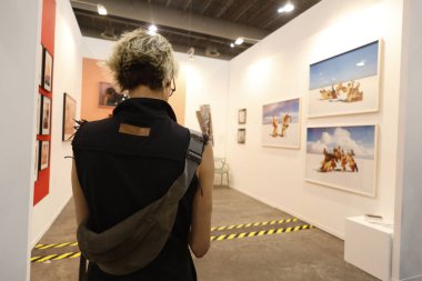 February 7, 2024, Mexico City, Mexico: A person takes a tour during the Zona Maco Contemporary art exhibition  at Centro Citibanamex clipart