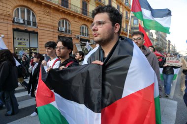 March 15, 2024 , Naples , Italy : Demonstrators take part during a protest to  took place to call out loud to stop the genocide of the Palestinian people clipart