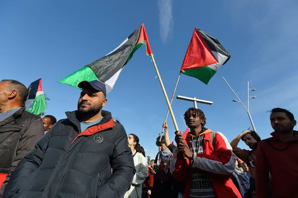 stock image March 15, 2024 , Naples , Italy : Demonstratorsholds flags while take part during a protest to  took place to call out loud to stop the genocide of the Palestinian people