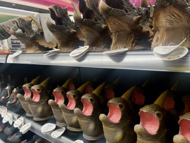 Tenerife, Spain - 20.05.2023: Dinosaur Toys on a shelf in the supermarket for background. High quality photo