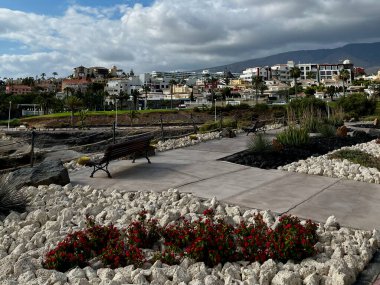 Costa Adeje, Spain - 17.05.2023: Coastal promenade in Costa Adeje holiday town. Plaza del Duque. High quality photo