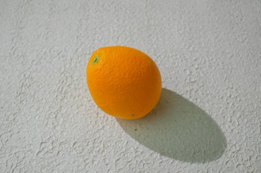 A vibrant orange isolated on a clean white background, representing freshness, health, and natural citrus goodness, ideal for food related visuals clipart