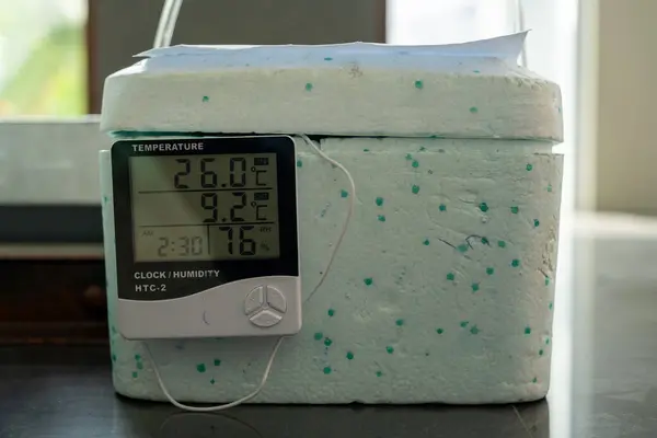 stock image dry box made of styrofoam to protect blood bags with a hygrometer as a tool to measure humidity and temperature