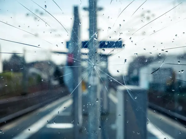 stock image Close up of cracked glass pane at train station