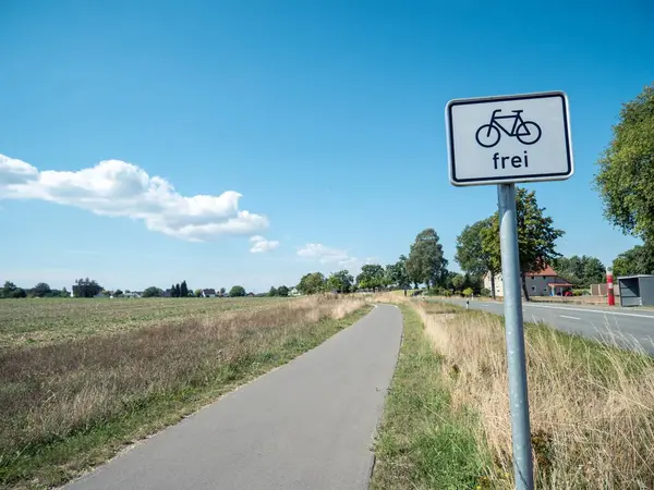 stock image Idyllic bike path under blue sky