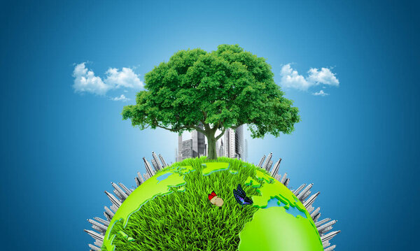 eco and environmental concept. The big tree growing between modern building on top of the earth. city and world creative concept manipulation. world environment day. earth day, world planet day.