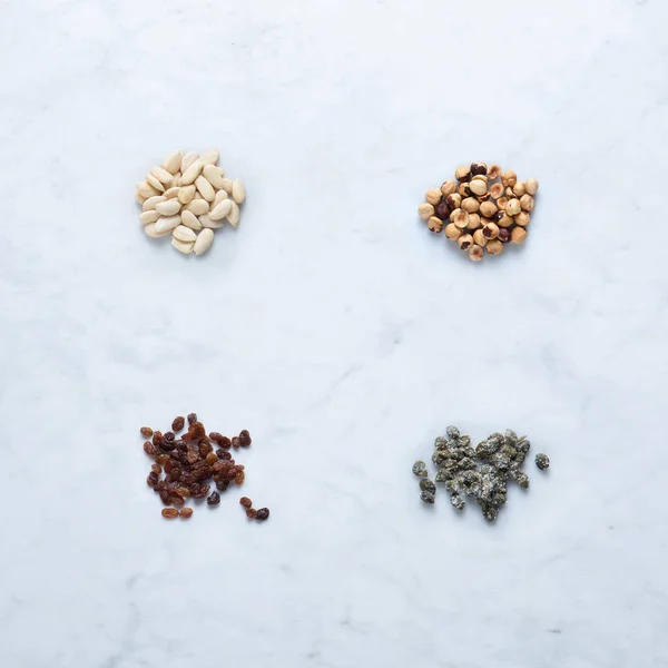 Ingredients Italy Seasoning Isolated Marble Background Heaps Almond Hazelnut Peeled — Stock Photo, Image
