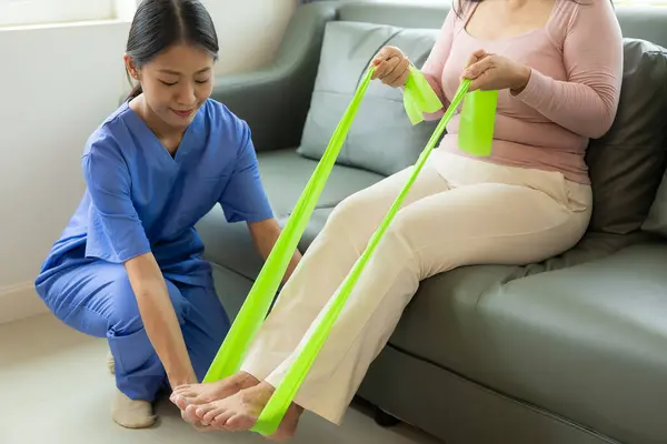 Elderly Female Patient Asian Female Physical Therapist Holding Her Arm — Stock Photo, Image