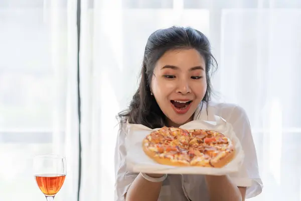 Group of Asian female friends at a party Have a fun time together. pizza party wine drinks Celebrating an important moment