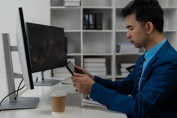 Forex traders Man in front of multiple computer monitors Automated computer monitor of business processes from financial stock analysis data graphs.
