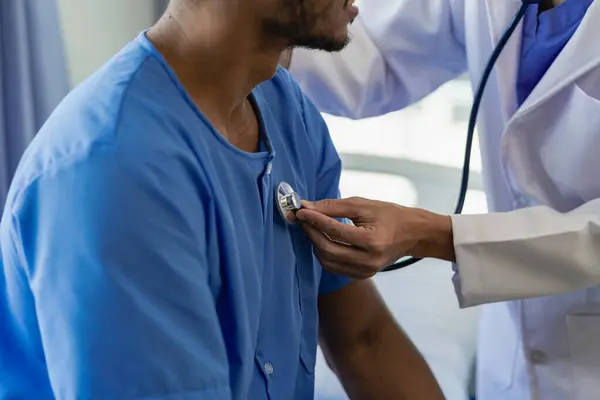 A doctor uses a stethoscope to check the heartbeat of his patient. Patients must undergo a yearly check-up for their health or a check-up from a cardiologist.