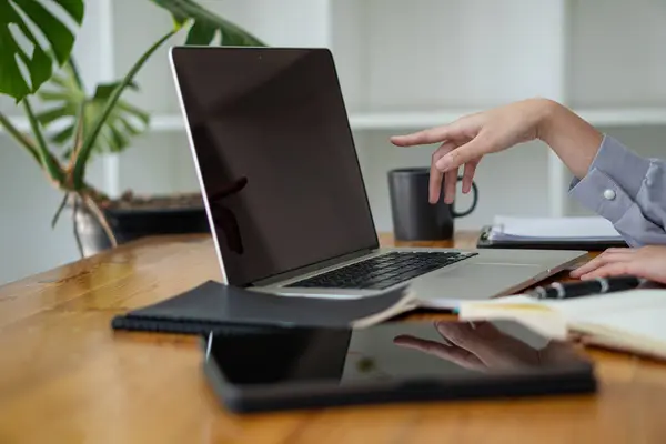 stock image Hand using laptop computer and internet Type on the keyboard to search for information. Freelance copywriter, online shopping, typing text, close-up images.