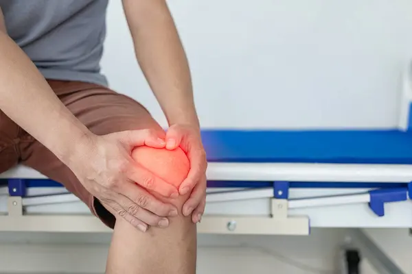 Close Man Holding His Knee Discomfort Suffering Knee Pain While — Stock Photo, Image