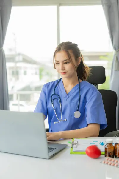 Beautiful Young Female Doctor Working Laptop Read Electronic Medical Records Jogdíjmentes Stock Fotók