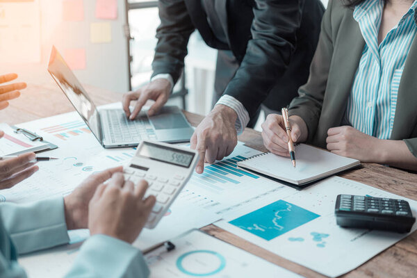 Business meeting, various international executives discuss reports at the meeting table, project negotiation committee develops business strategies by analyzing documents, graphs, close-up images.