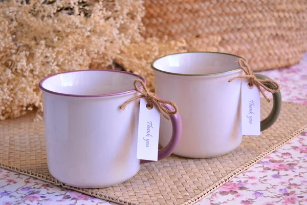 Wedding favors white tea coffee mugs original thank you gifts for party guests, custom cup with jute ribbon and label for weddings presents, pastel color background