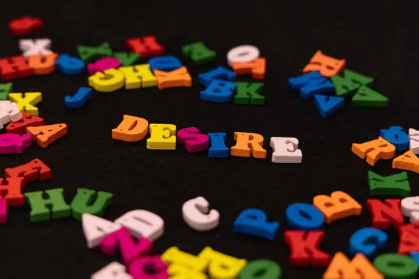 stock image Wooden letters painted in vibrant colors spell out 