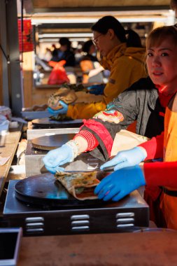 Barcelona - Spain, 25 January 2025:Stalls filled with traditional Chinese dishes attract visitors during the festive celebration of Chinese New Year in Barcelona clipart