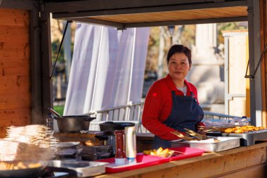 Barcelona - Spain, 25 January 2025: Vibrant Chinese food stalls offer traditional dishes and decorations as part of the lively Chinese New Year celebration clipart