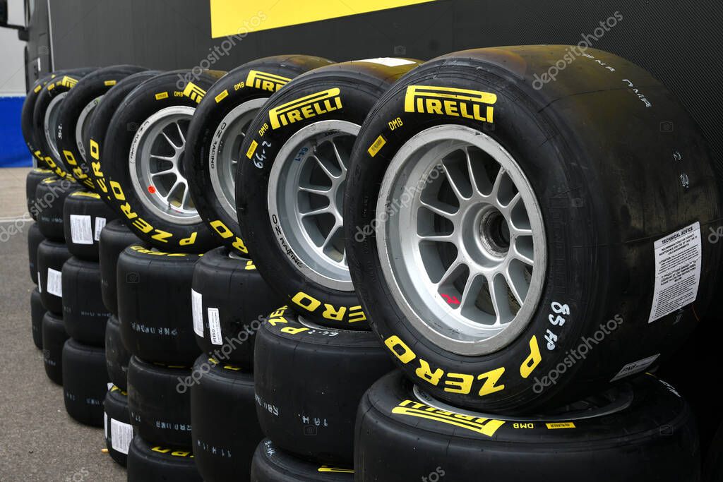 Scarperia, Italy, 21 October 2022 - Yellow Pirelli tires mounted on alloy wheels in the paddock of the Mugello circuit during the ACI CSAI Racing Weekend 2022.