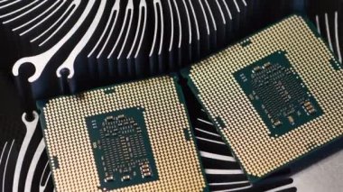 detail of two modern computer processor on top of aluminum heat sinks
