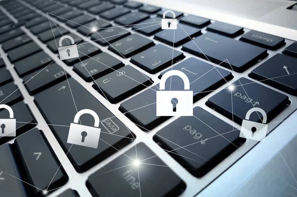 Cyber security and data protection concept with interconnected padlock symbols on modern laptop keyboard background