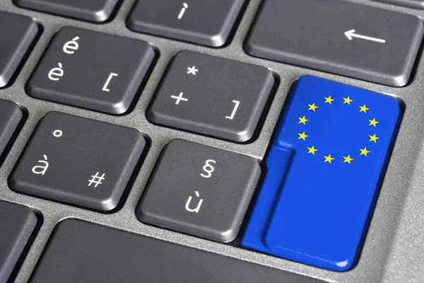 EU flag on computer keyboard button, The European flag which symbolizes both the European Union and the unity and identity of Europe in general.
