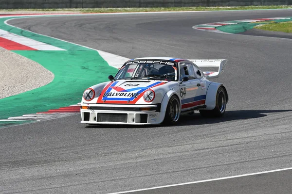 stock image Scarperia, 2 April 2023: Porsche 934-935 year 1976 in action during Mugello Classic 2023 at Mugello Circuit in Italy.