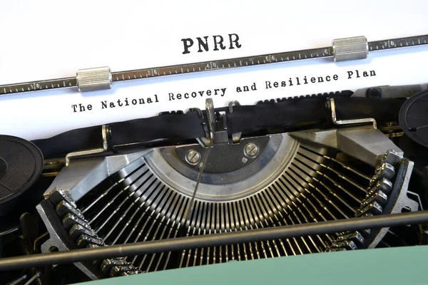 words \'PNRR The National Recovery and Resilience Plan\' typed on vintage typewriter. The National Recovery and Resilience Plan is part of the Next Generation programme, that the European Union negotiated in response to the pandemic crisis Covid 19.